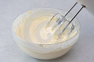 Cream cheese whipped cream  close up in a glass bowl