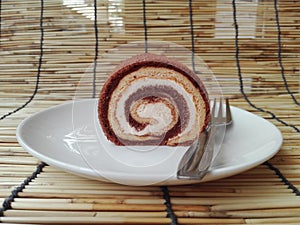 Cream chocolate and vanilla layer cake roll
