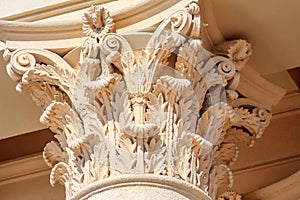 Cream color Italic Corinthian column capital fragment. Ancient architectural order building decor