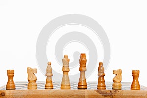 Cream colored wooden chess pieces