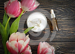 Cream cosmetic flower tulip spring  fresh    wellness frame on wooden background