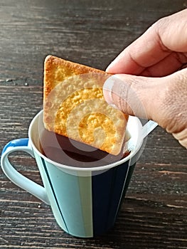 Cream crackers soaked in tea water