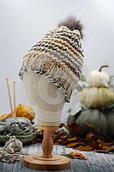 Cream and Grey Handknit winter hat on mannequin head