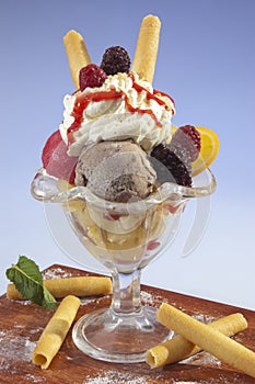 Cream ice sundae w fruit and whipped cream