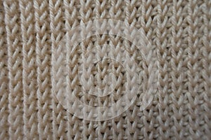 Cream knitted fabric from above ribbing pattern photo