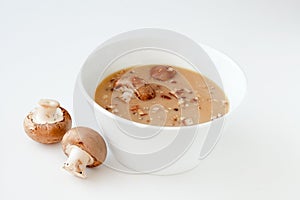 Cream mushroom soup in white ceramic bowl