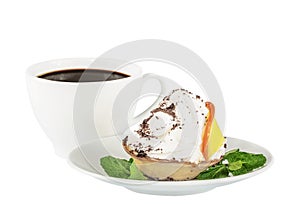 Cream orange and chocolate cake on a white saucer and coffee