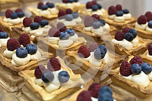 Cream pastries with Raspberries and Blueberries