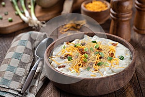 Cream of potato soup with bacon, cheese and green onions