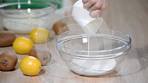 Cream pouring into a bowl.