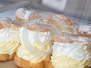 Cream puffs in pastry shop photo