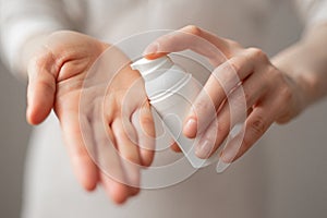 Cream skin care hands. Close-up woman holding cream for hands. Woman applying hand cream. Girl holding tube with skin care product
