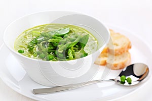 Cream soup with asparagus, peas and leeks