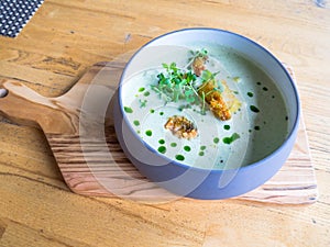 Cream soup of asparagus with shrimps, selective Focus