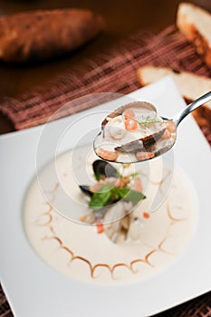 Cream soup with seafoods photo