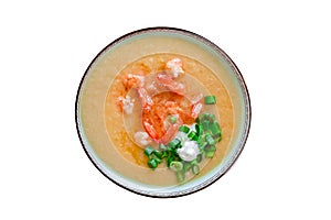 Cream soup with shrimp and herbs bowl, top view, isolated on white background with clipping path