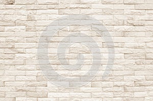 Cream and white brick wall texture background. Brickwork or stonework flooring interior rock old pattern clean concrete grid