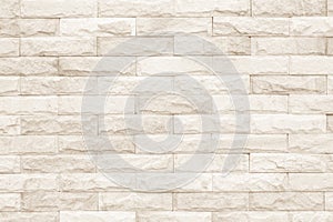 Cream and white brick wall texture background. Brickwork or stonework flooring interior rock old pattern clean concrete grid