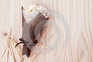 CREAM white roses flowers with valentine festival gift and beautiful blur bouquet and love word on the bouquet. flower on the wood