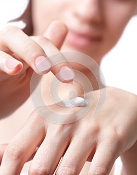 Cream on the women hand