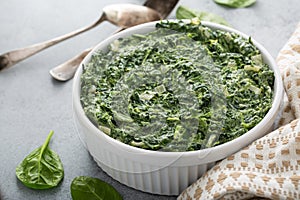 Creamed spinach in a white bowl