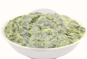 Creamed spinach in a white plate