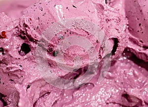 Creamy blueberry lilac ice cream macro closeup as background.