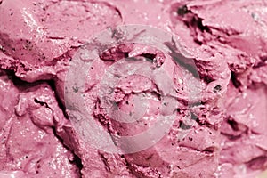 Creamy blueberry lilac ice cream macro closeup as background.