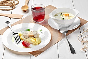 Creamy broccoli soup, mashed potatoes with car shaped chicken patty, berry drink