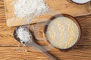 Creamy cocada, traditional brazilian coconut candy with grated coconut