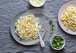 Creamy corn pasta. Linguine with creamy corn on a gray background