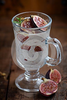 creamy dessert with figs in a glass.