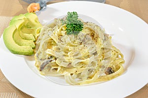 Creamy Fettuccine Alfredo with Mushroom Served along with Avocado