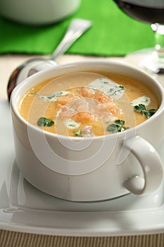 Creamy fish soup with herbs photo