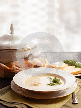 Creamy fish soup with salmon, potatoes and dill