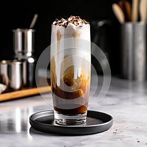 Creamy, frothy drink in a tall glass with milk, seltzer, and chocolate syrup