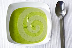 Creamy green soup of wild garlic and spinach photo