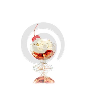 Creamy ice cream with cherries on plate in glass bowl