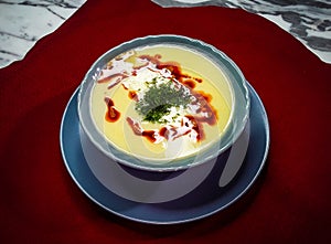 Creamy lentil soup on the blue bowl.