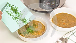 Creamy lentil soup close up on kitchen table.