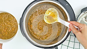 Creamy lentil soup cooked in multi cooker close up directly from above