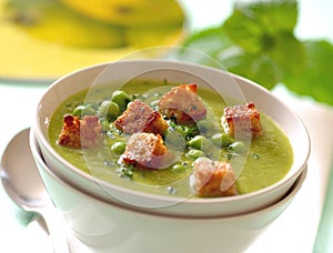 Creamy mint pea soup with croutons.