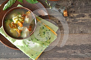 Creamy mushroom soup with fresh forest chanterelles and greenery. Flat lay