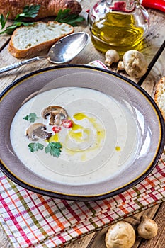 Creamy Mushroom Soup on rustic wooden table