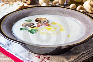 Creamy Mushroom Soup on rustic wooden table