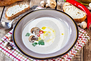 Creamy Mushroom Soup on rustic wooden table