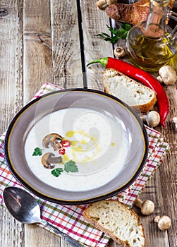 Creamy Mushroom Soup on rustic wooden table