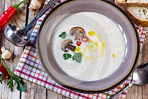 Creamy Mushroom Soup on rustic wooden table