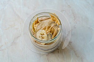 Creamy Peanut Butter Pie Dessert with Banana Slice and Chocolate Cake in Jar / Paleo Diet Cup