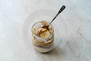 Creamy Peanut Butter Pie Dessert with Banana Slice and Chocolate Cake in Jar / Paleo Diet Cup